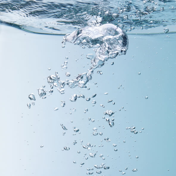 Bubbles rising to the surface of a river.